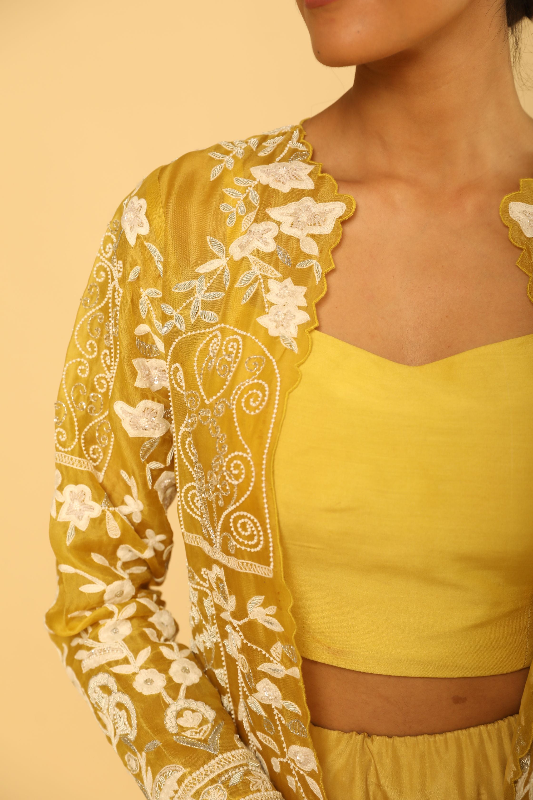 Yellow Mid Length Embroidered Jacket With Silk Bustier And Skirt
